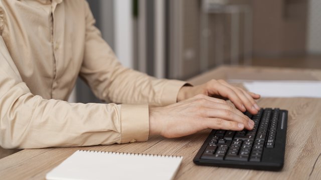 close-up-hands-typing-keyboard